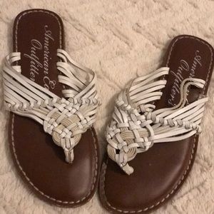 American eagle flip flops white